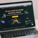A laptop computer sitting on top of a white table
