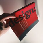 a person holding a book in their hand